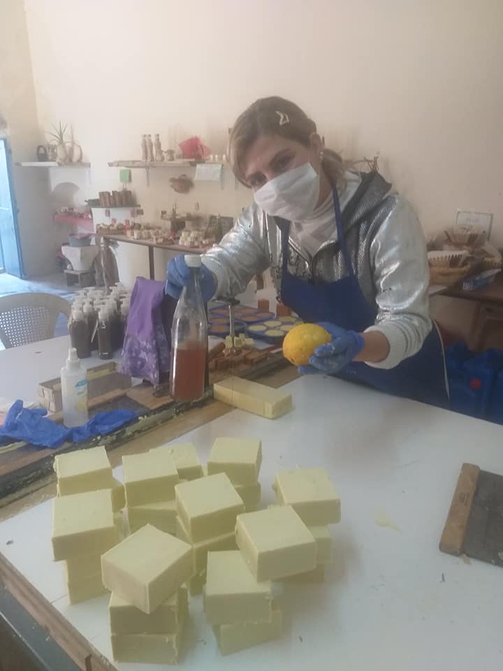 Linda cutting handmade soap blocks in her studio
