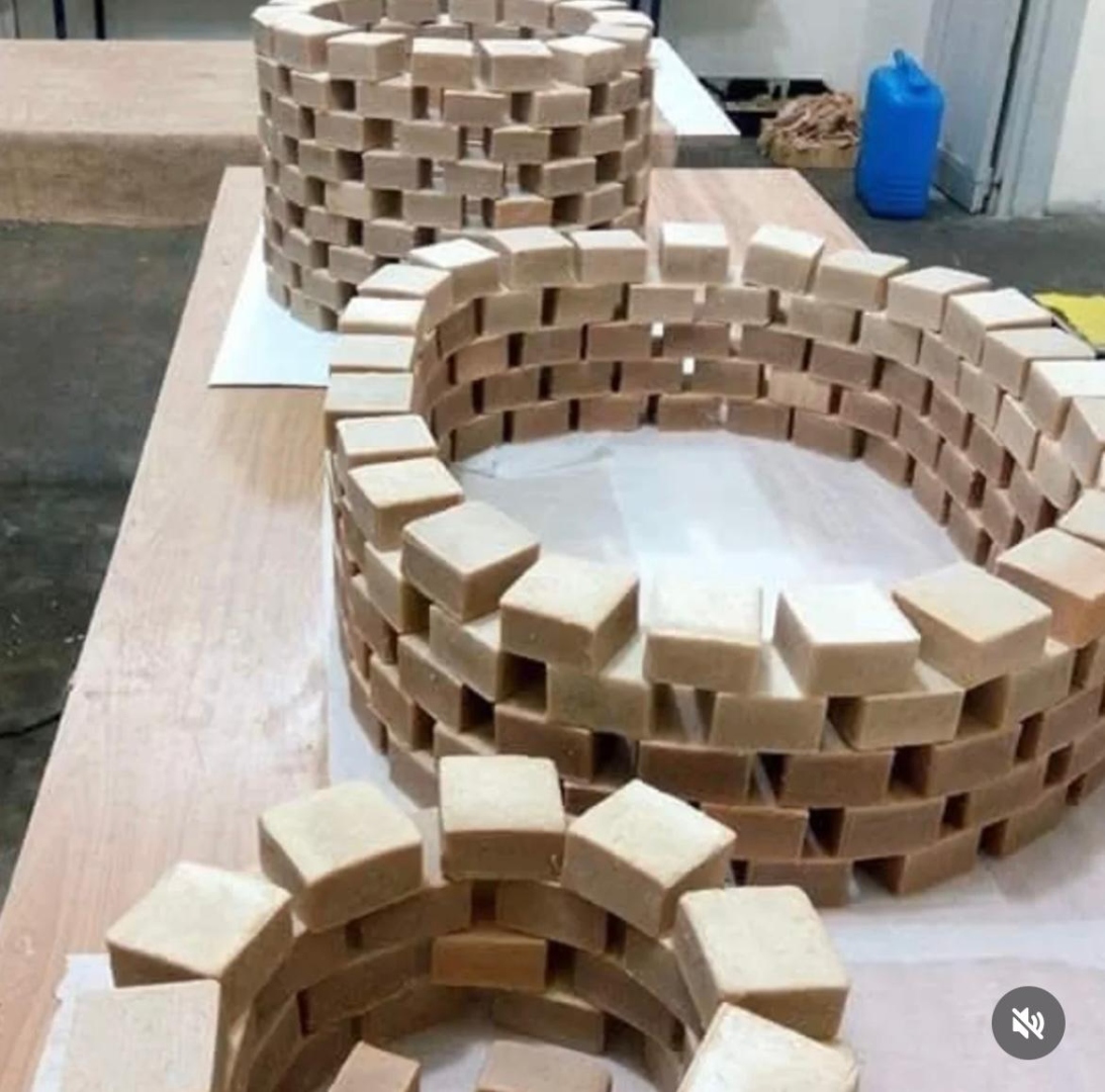 Handmade soap bars stacked in artistic spirals